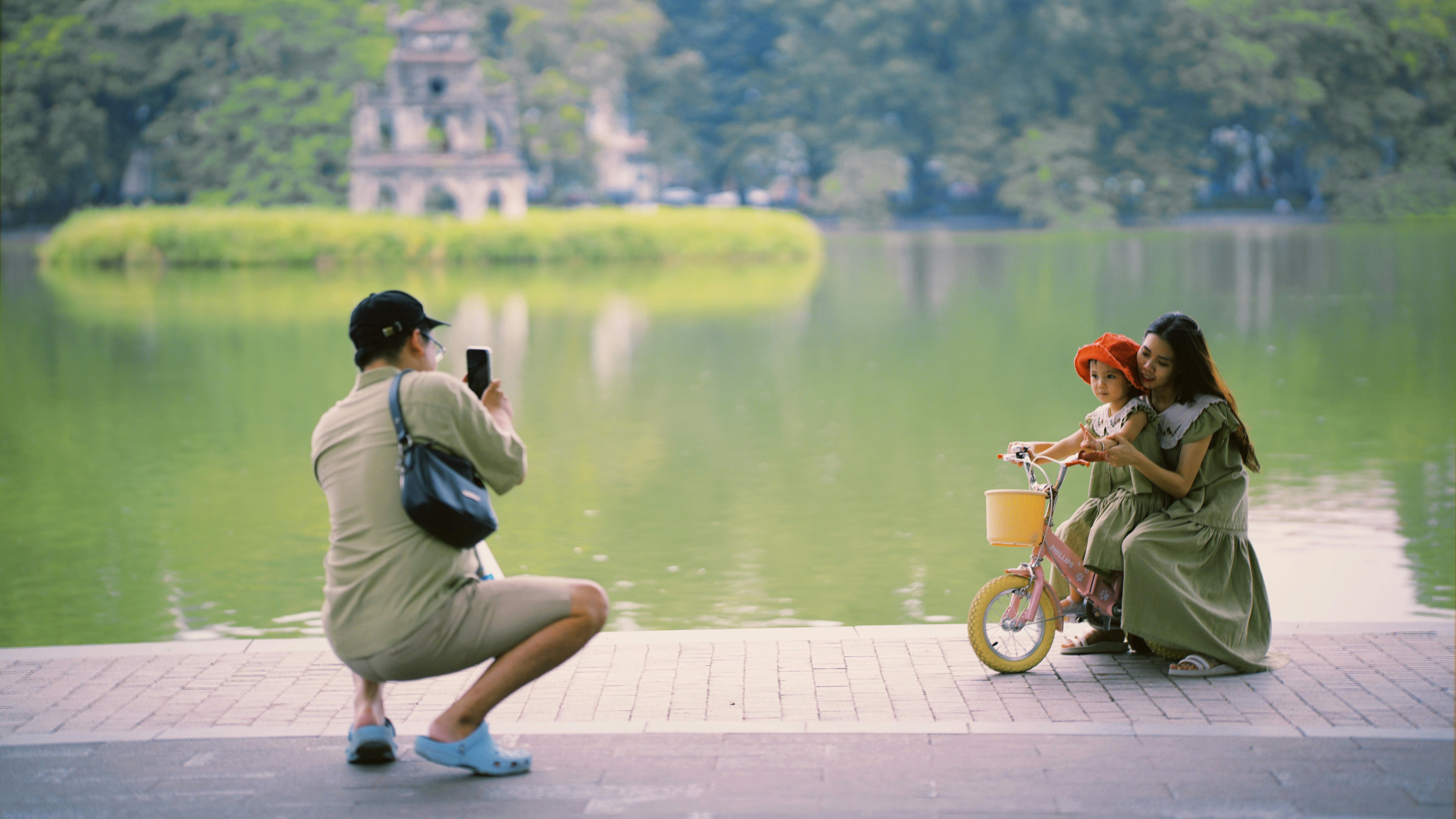 taking picture in Hoan Kim lake